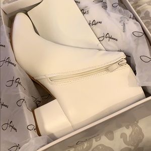 Cute white low heel ankle booties. Never worn.